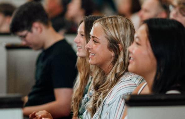 Students seated in an auditorium.